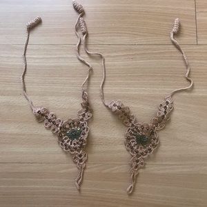 Dusty pink footless sandals with brass butterfly detail